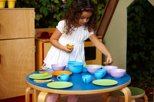 Girl playing with Cookware and Dining Set