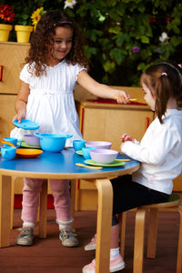 Girls playing with Cookware and Dining Set
