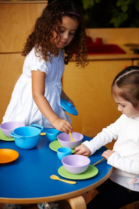Girls playing with Cookware and Dining Set