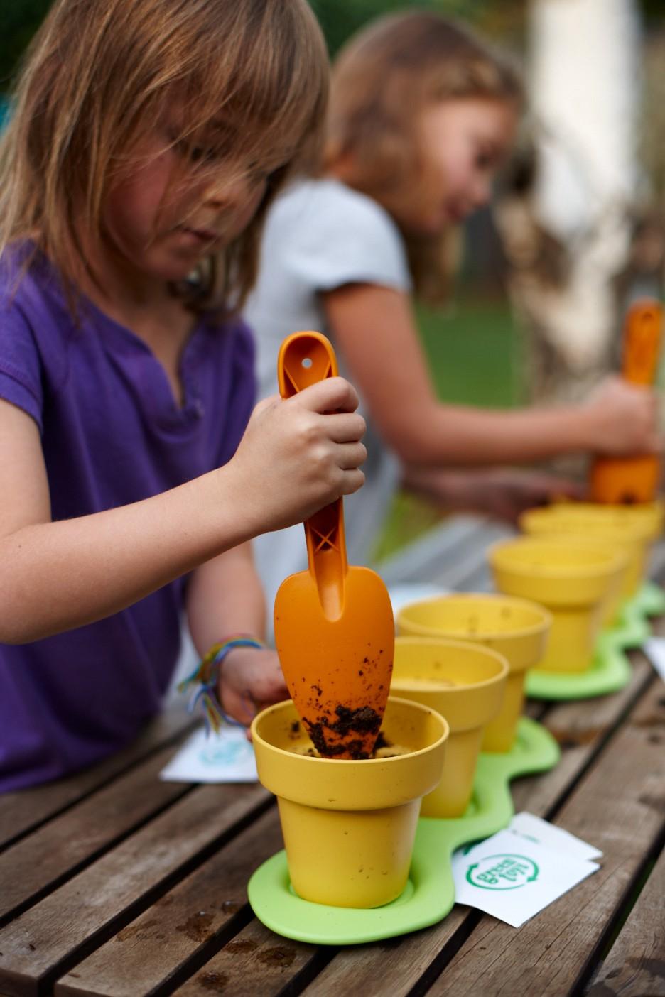 Two girls planting with Indoor Gardening Kit