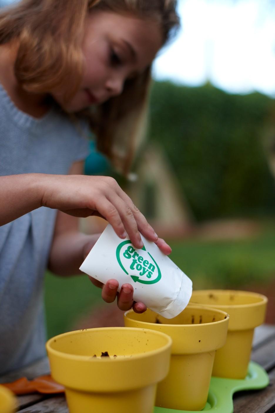 Girl planting with Indoor Gardening Kit