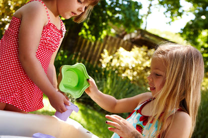 Two girls playing with Stacking Cups